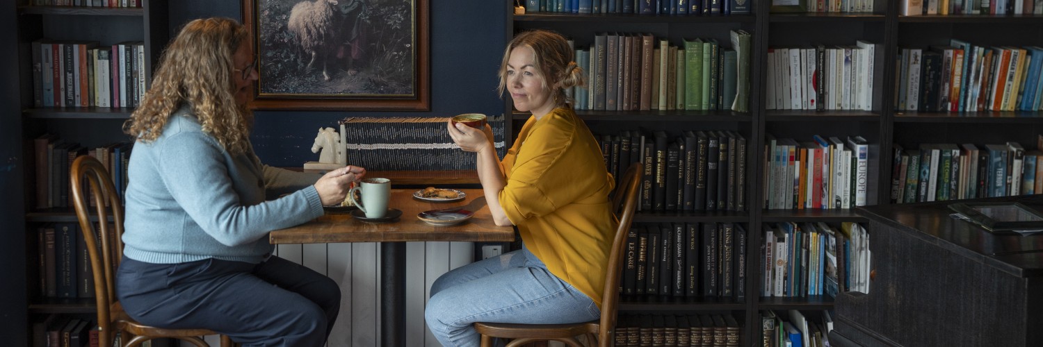 Guests enjoying coffees in Howling Wolf Artisan Bakery and Café below the Beacon Museum in Whitehaven